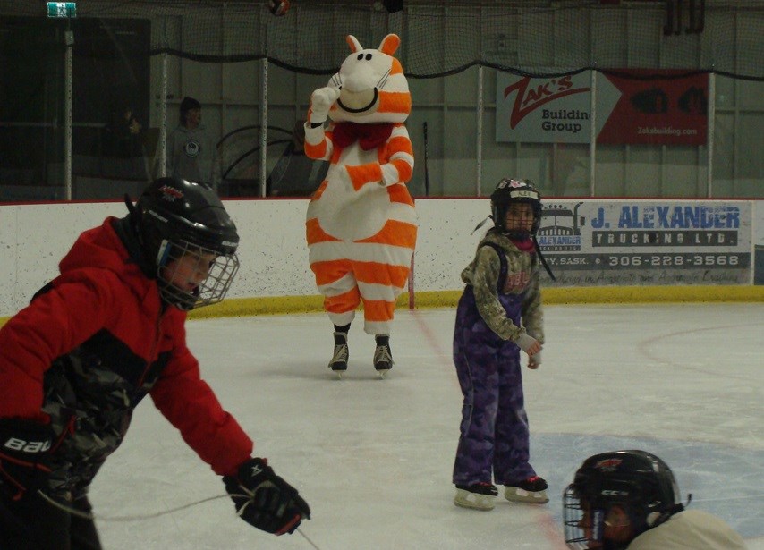 Unity Credit Union mascot, Fat Cat, shows off his icy moves during a free skate following some games on the rink surface.                             