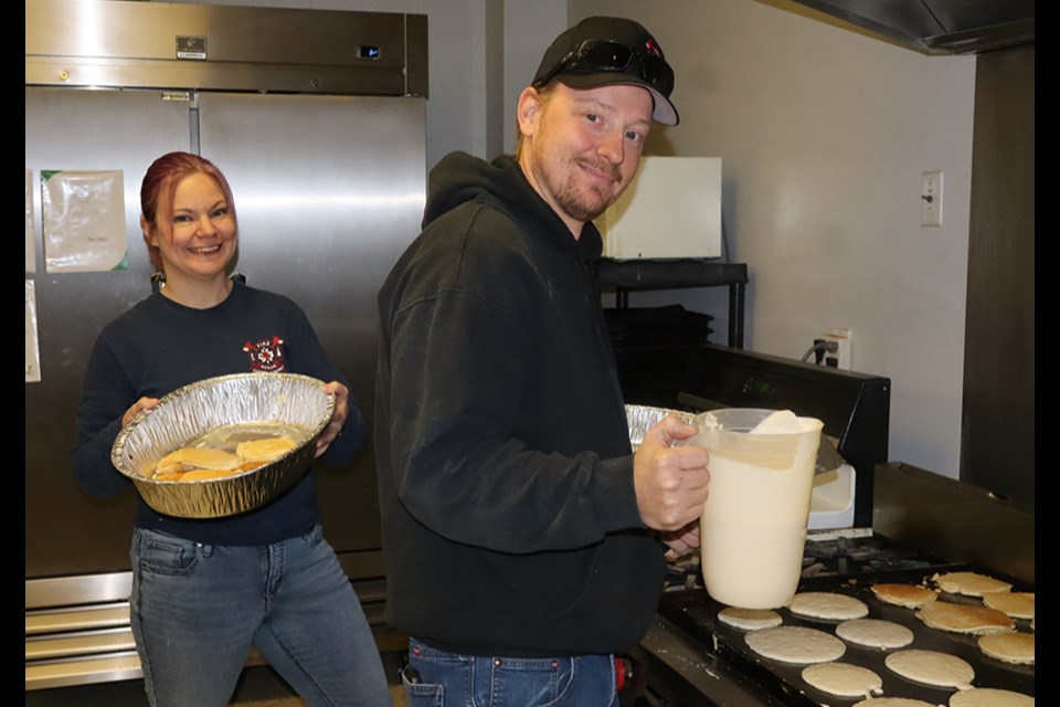 Business was brisk and the firefighters were kept busy at the Canora & District Firefighters Pancake Breakfast, held as part of Fire Prevention Week at the Curling Rink on Oct. 12. As fast as Firefighter Devin Trynchuk, right, made the pancakes, Firefighter Cheri Kuhn gathered them up for hungry visitors.