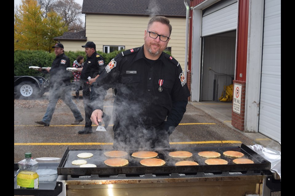 Firefighter Shannon Leson was busy flipping pancakes to make sure everyone was well fed at the Canora & District Firefighters Pancake Breakfast, held as part of Fire Prevention Week at the fire hall on Oct. 14. This year’s theme was “Cooking Safety Starts with You.” Fire Chief Jess Harper said he and the other firefighters were happy to bring the event back after an unplanned absence due to COVID-19.  