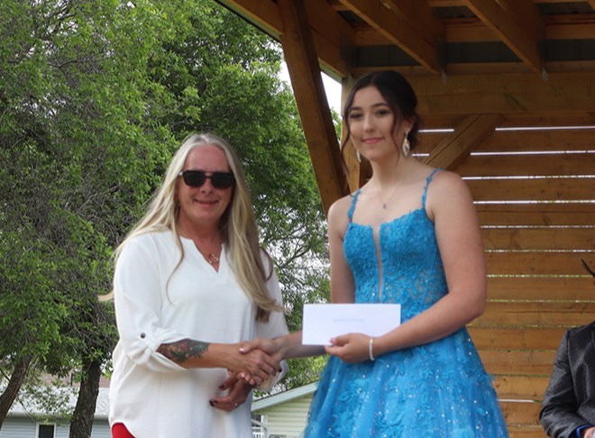 Bailee Zuravloff, right, received the Aspen Paramedic scholarship from Carla Steciuk. Steciuk also earned the Gateway Co-op scholarship.