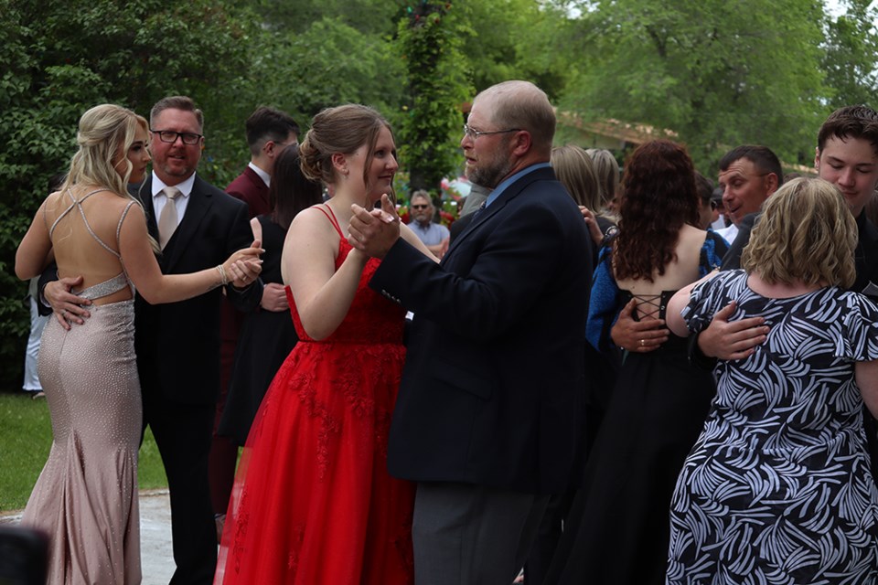 After the graduation exercises, the grads celebrated by going for a spin around the dance floor. 