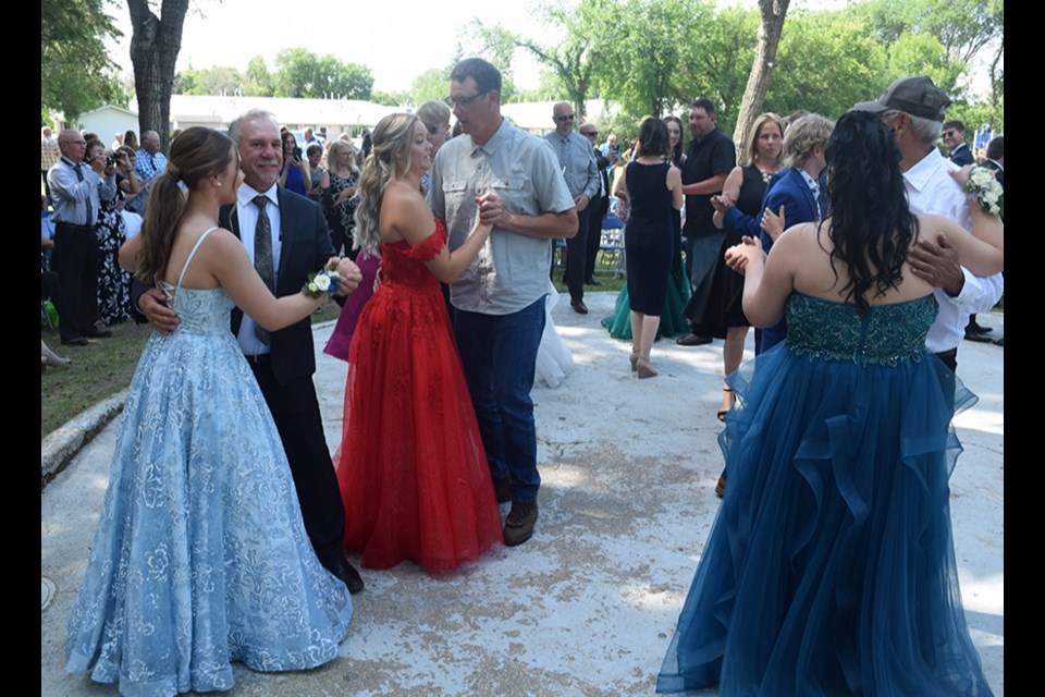 After the presentation of graduation scrolls, graduation exercises closed with a spin around the dance floor. 