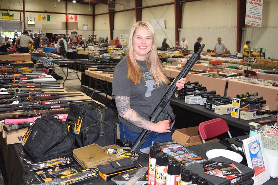 With a wide assortment of guns and ammunition available, Paige Scheller, co-owner of DJ Gun Sales of Margo, was busy looking after the needs of hunters at the ninth annual River Ridge Fish & Game Gun Show on June 10-11.

