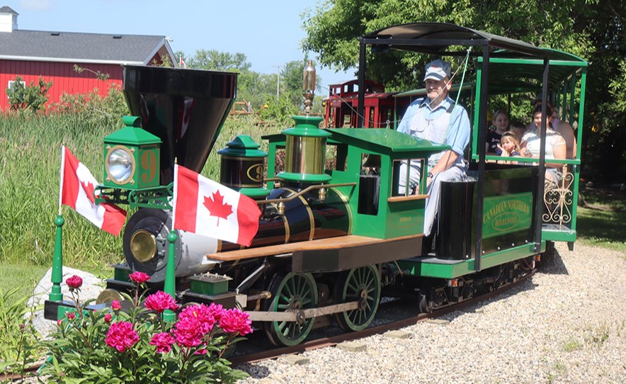 With Wally Huebert as the engineer, son Jordan and other visitors to the Huebert Homestead had the opportunity to enjoy train rides under sunny skies and warm temperatures on July 8. 