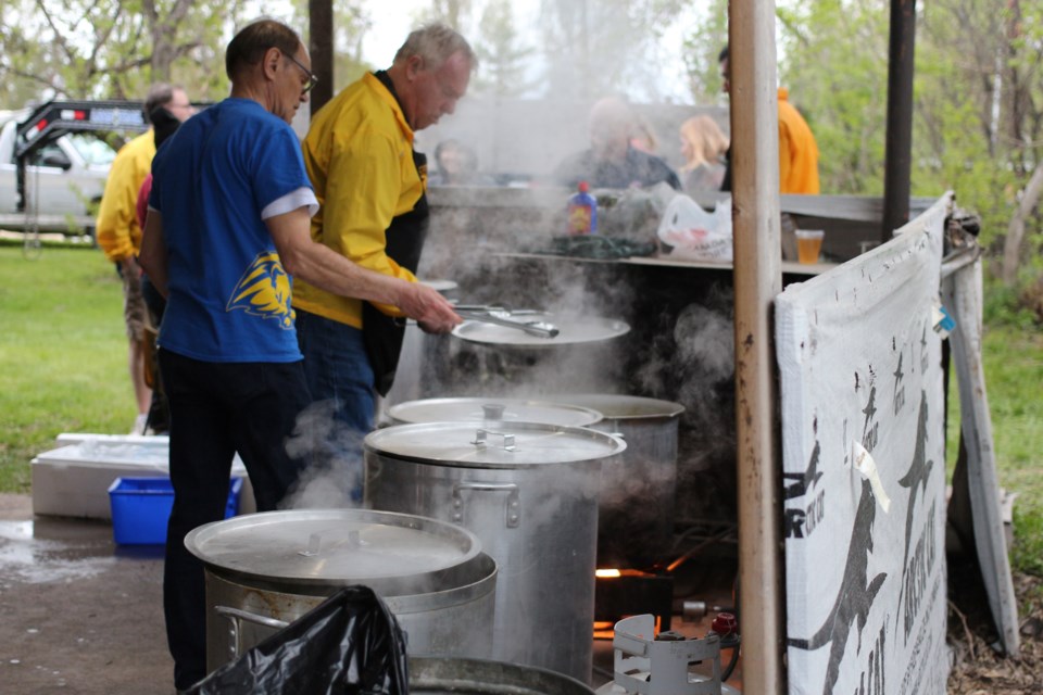 Members of the Yorkton Lions cook up lobster and steak for attendees.