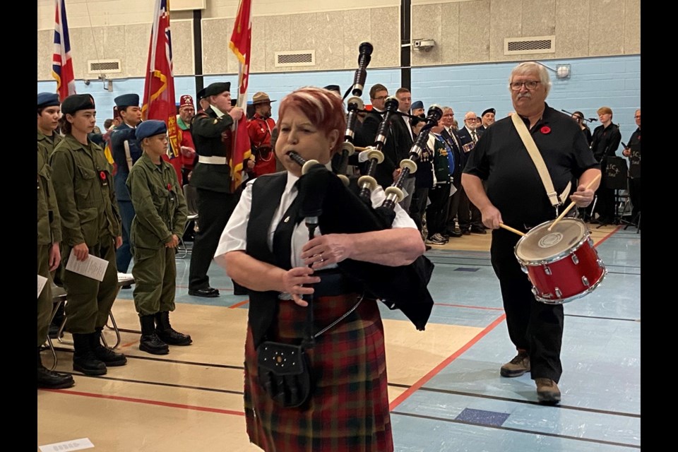 Lynda Lyon-Walls, on the bagpipes, in the procession at the start of the ceremony.