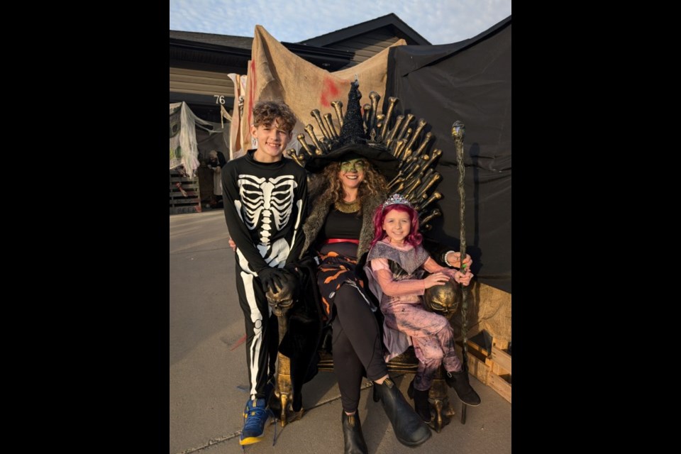 Kristin Weber-Karcha, center, has organized a haunted house at her home for the past four years.