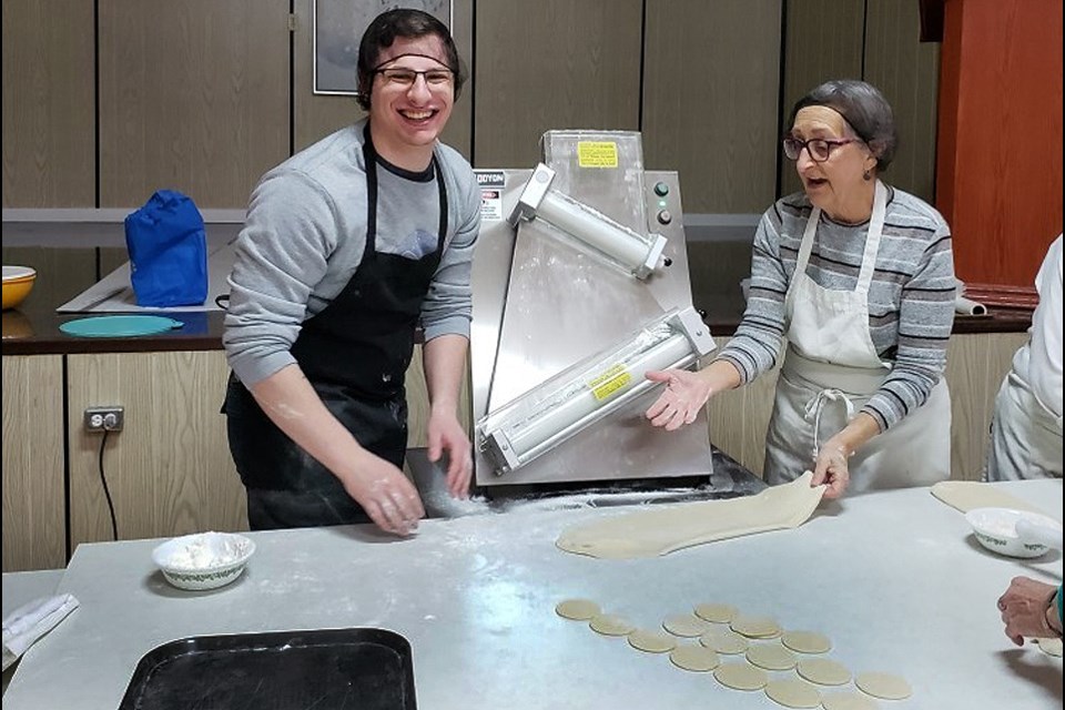 Perogy preppers are all smiles during a mass production of perogies to be sold benefitting the Veregin New Horizons Community Hall and Senior Centre.