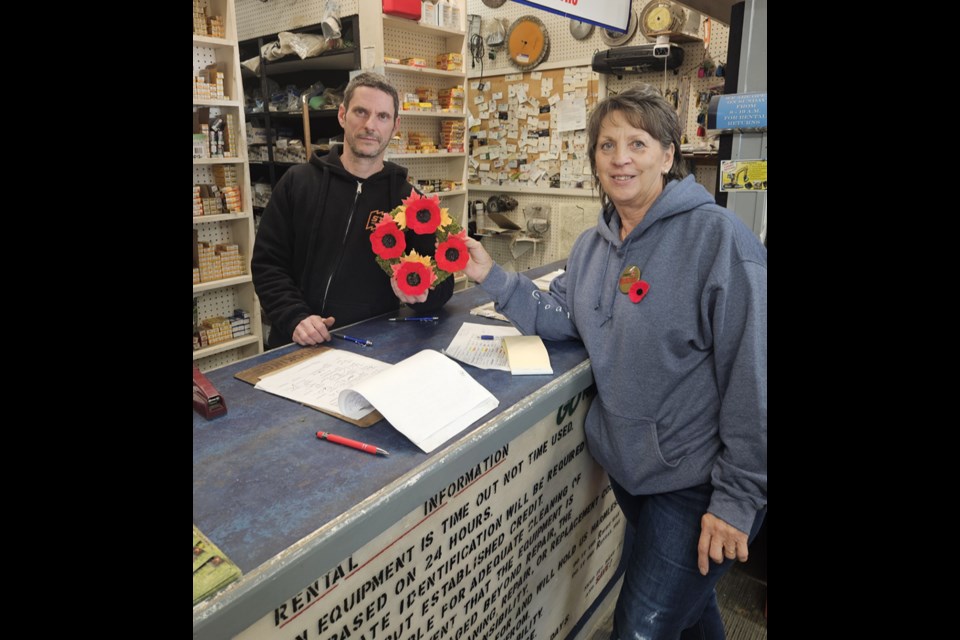 Jeff Keyowski of Canora Equipment Rentals accepted a poppy presentation from Deb Gabora of the Canora branch of the Royal Canadian Legion. 