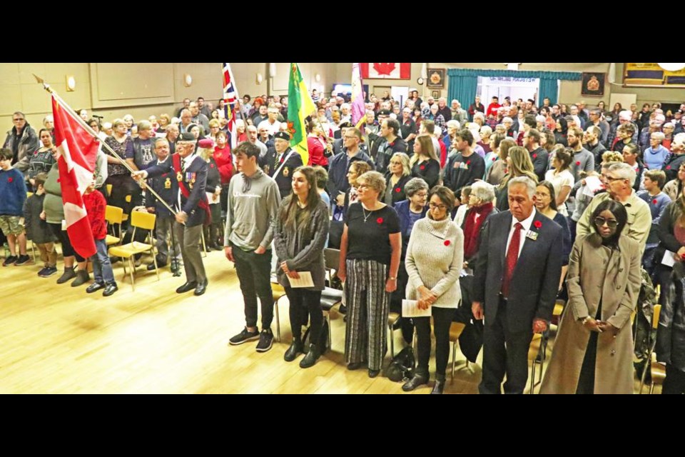 The Weyburn Legion's Colour Guard entered the auditorium to begin the service for Remembrance Day on Saturday.