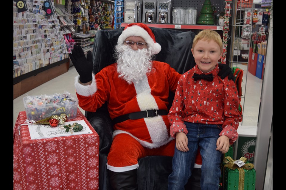 Six-year-old Jax MacLeod was thrilled to have the opportunity to spend some quality time with Santa Claus at the Red Apple Store in Canora on Dec. 9, all part of Fill the Sleigh Day.