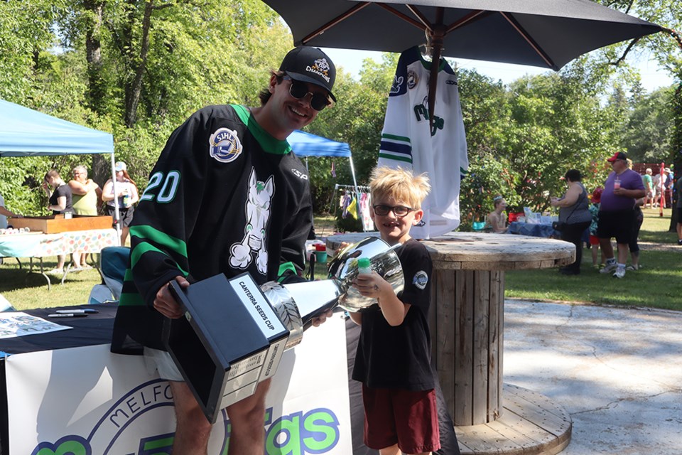 A highlight of Streetfest & Party in the Park, Clay Sleeva brought the Canterra Seeds Cup, which he won with the Melfort Mustangs as SJHL champions this past season. Seven-year-old Cooper Kyle, an up-and-coming young hockey player, jumped at the opportunity to have his picture taken with Sleeva and the Cup. 