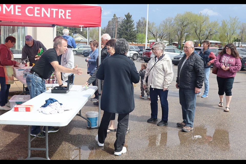 Business was brisk at the fundraiser barbecue outside Gateway Co-op on May 21 during Gateway Co-op Equity Days. Skies cleared just in time for many hungry Canora and area residents to show their support for the upgrade and conversion of the tennis courts into a multi-use recreational court for pickleball, tennis and basketball. 