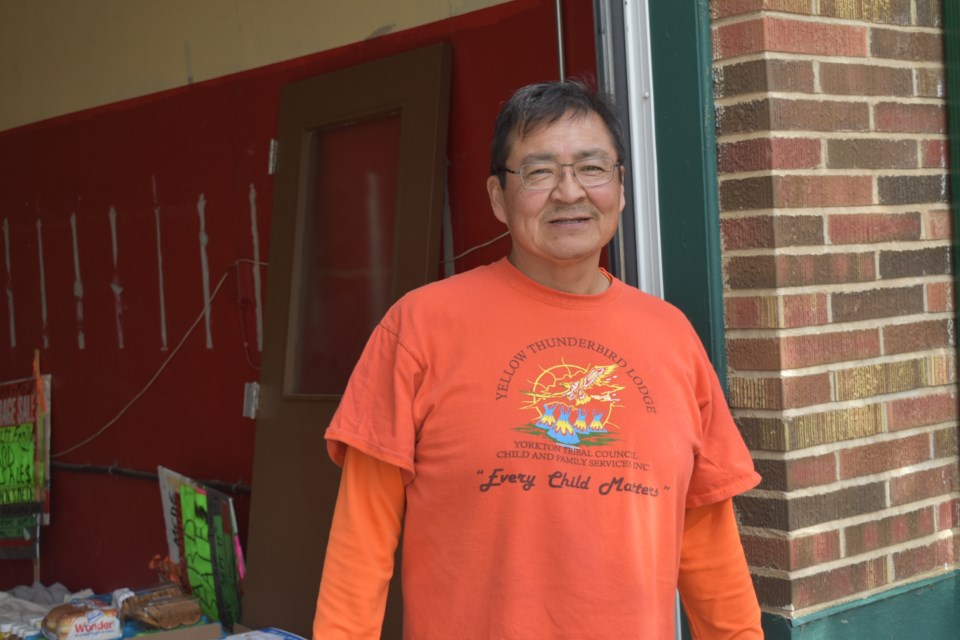 Denzel Kitchemonia, the new Recreation Director, was behind the stand handing out food during the event.