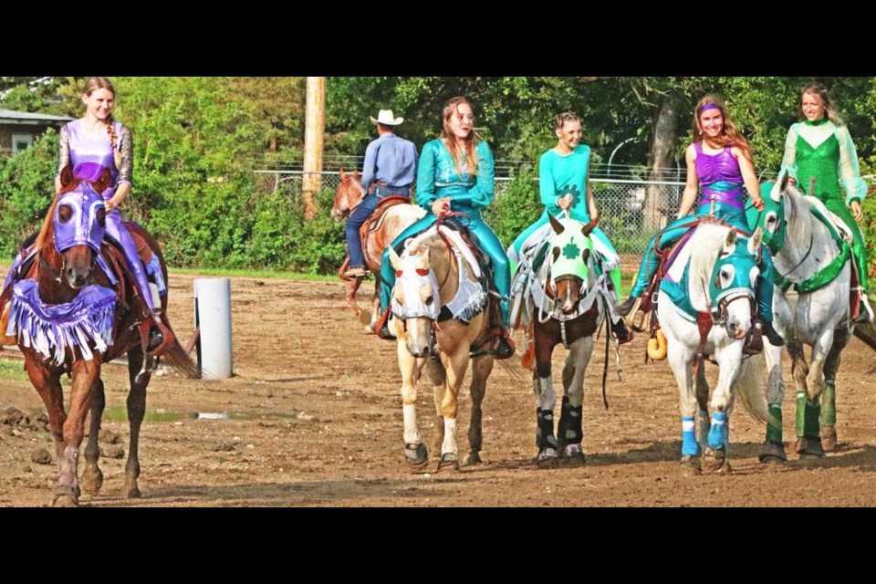 The Truco Trick Riders rode up to the rodeo arena just prior to their performance at the Weyburn Fair on Thursday evening. From left are Bailey Steeves, Charlize Hallberg, Kyla Dyer, Shayda King and Jordanna White.