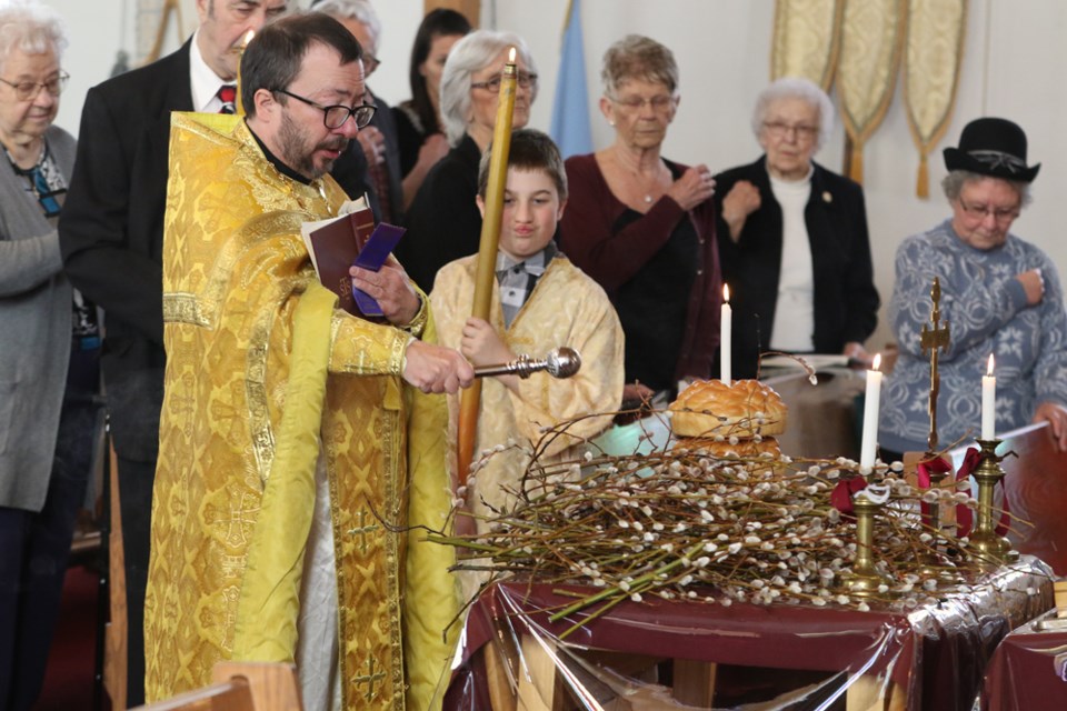 Father Charles Baxter, the chancellor of the Ukrainian Orthodox Church of Canada, blessed the pussy willow branches in anticipation of Ukrainian Palm Sunday on April 8 at the Canora Ukrainian Orthodox Church. Palm Sunday, held the Sunday before Easter (which for the Ukrainian Orthodox Church is on April 16) commemorates Christ's triumphal entry into Jerusalem. The pussy willows represent the palm branches that the crowd scattered before Christ as he rode into Jerusalem. The churchgoers then took the pussy willows home.