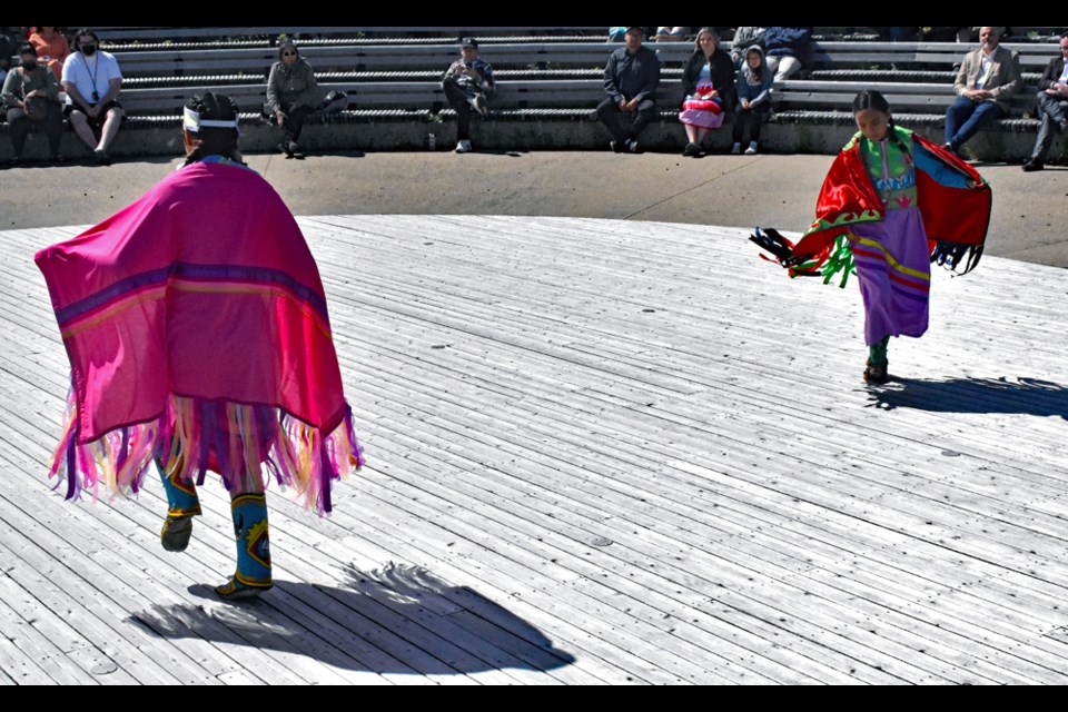 Two students perform the fancy shawl dance during the program at the amphitheatre.