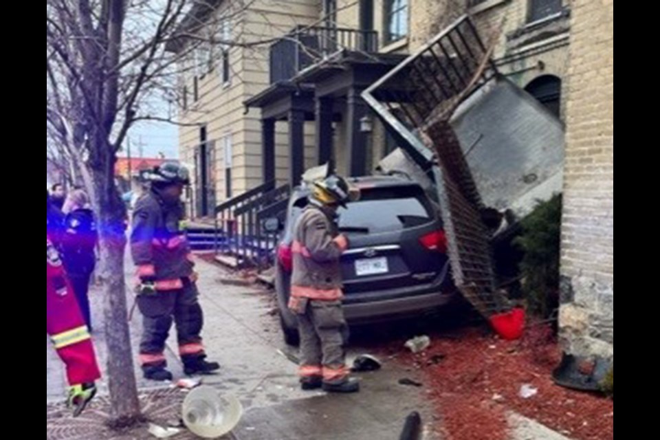 Firefighters ensured the building was stable and a tow truck pulled the vehicle away from the building. 