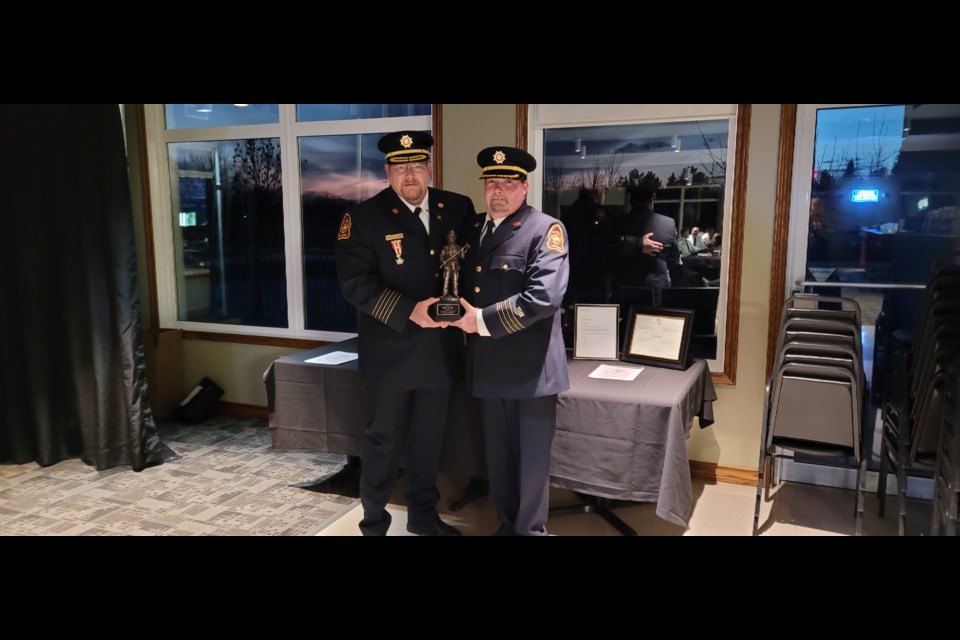 Deputy Cheif Rick Davies, right, received an award for 20 years of service