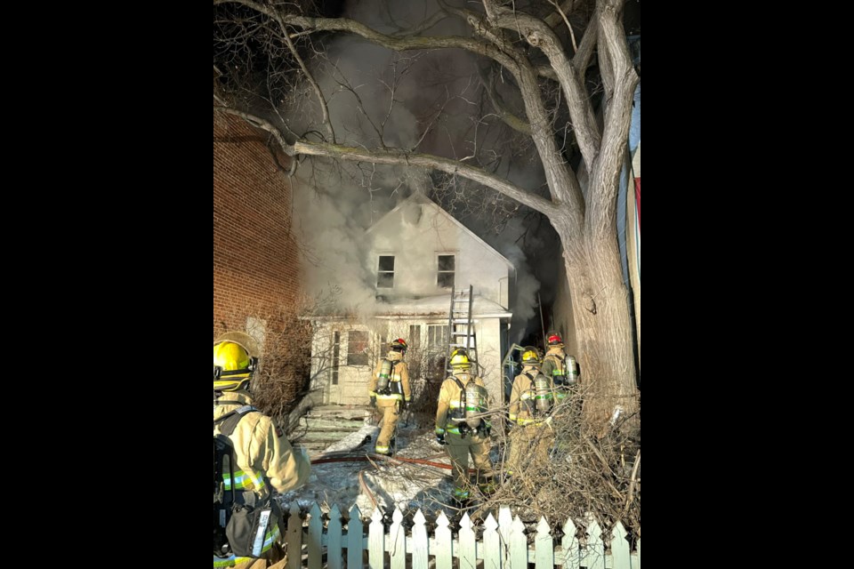 Fire crews work to extinguish an early morning fire on Halifax Street.