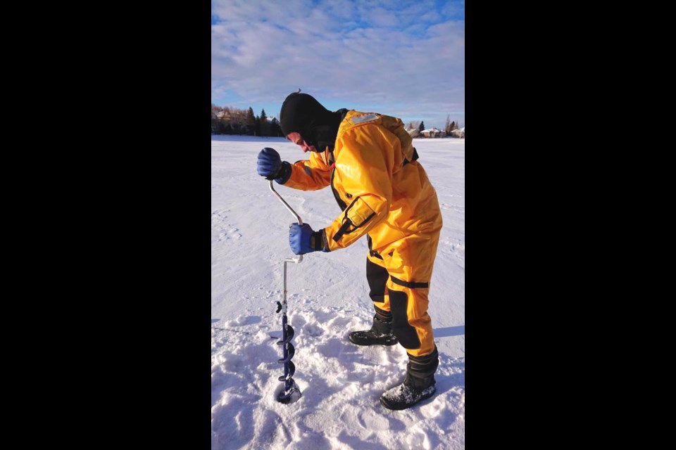 A Saskatoon Fire Department crew checks the thickness of the ice.