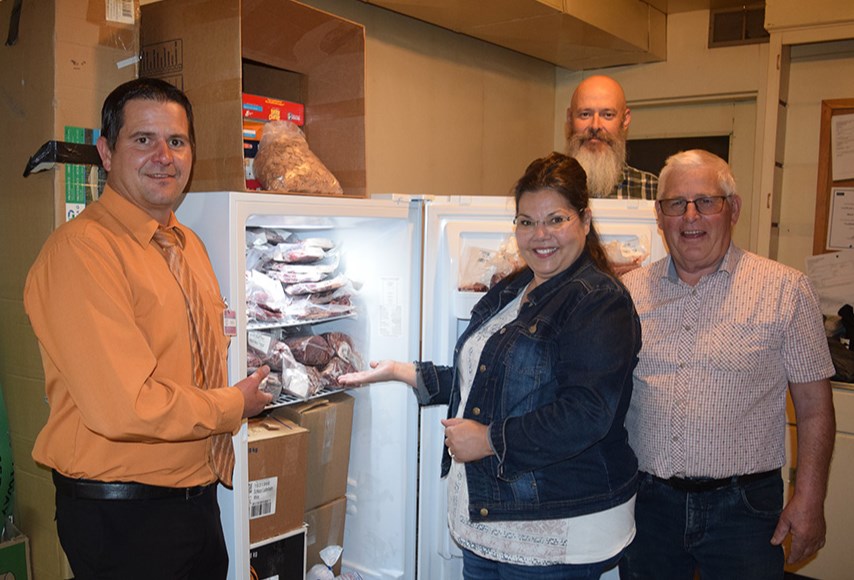 With the increasing money-related pressures faced by Filling The Gap Food Bank in Canora, the donation of a side of beef by Gateway Co-op on Sept. 6 was a welcome boost, amounting to approximately 450 pounds of meat. It was a 4-H steer purchased by Gateway and processed by Cool Springs Ranch of Endeavour, which donated the cutting services. In the photo, from left, were: Brad Chambers, Gateway General Manager; Pastor Mavis Watson, volunteer administrator of Filling The Gap; Kris Hiebert, Gateway Food Division Manager, and Lyle Olson, Cool Springs Ranch. Watson said she was overwhelmed by the generosity of the donation, as well as the perfect timing. “Just recently I prayed, ‘Lord, we need some more meat,’ and this was His answer.”