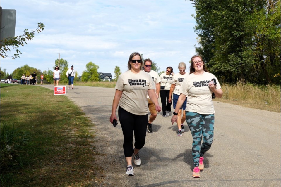 Jennifer Kuchinka, right, led Estevan's first Brain Boogie Walk on Saturday.