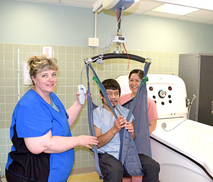 This scale, which can also move residents in and out of the tub, was one of the items donated to Canora’s Gateway Lodge thanks to funds provided by the Canora & District Healthcare Foundation. Three continuing care assistants at the lodge demonstrated how the scale works. On the scale was Dee Jay Ruado, assisted by Stacy Wetzel, (left) and Catherine Damaolao.

