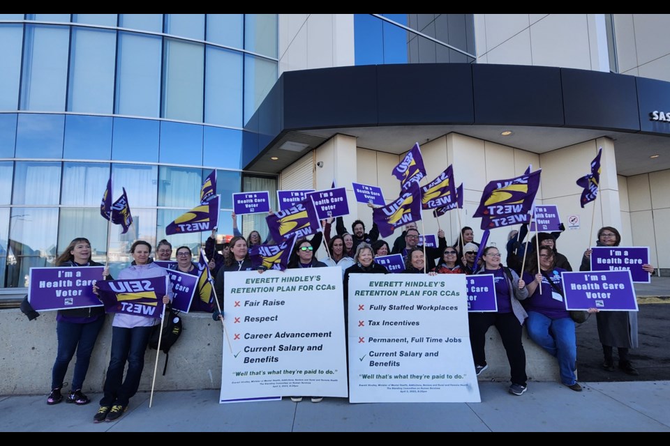 Saskatchewan Federation of Labour President Lauri Johb, seated fifth left, with Service Employees International Union-West leader Barb Cape and members during the three-day SFL Convention at TCU Place.