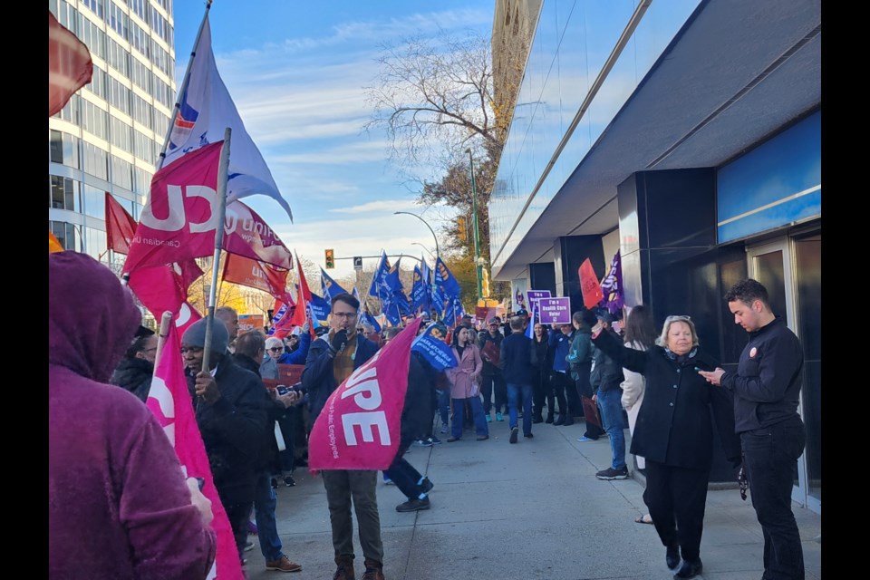 Saskatchewan Federation of Labour members protested in front of the Saskatchewan Cabinet Office on Thursday, Oct. 24.