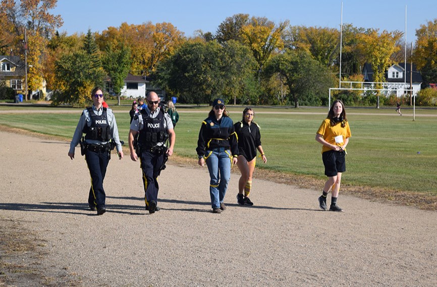 Canora RCMP members joined local students to participate and provide encouragement at the Terry Fox Run on Sept. 20. From left, were: Cst. Bailey Potts, Sgt. Derek Friesen, and Grade 10 students Maisie Kuzminski, Irena Yannoulis and Mataya Ball.