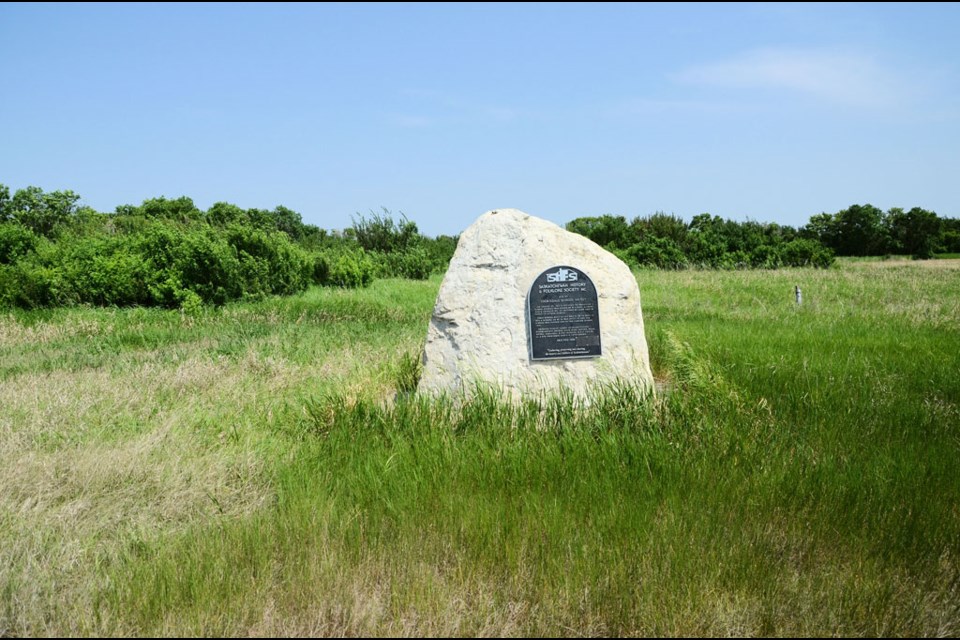 A large rock moved from a nearby field holds a plaque commemorating Thorndale School.