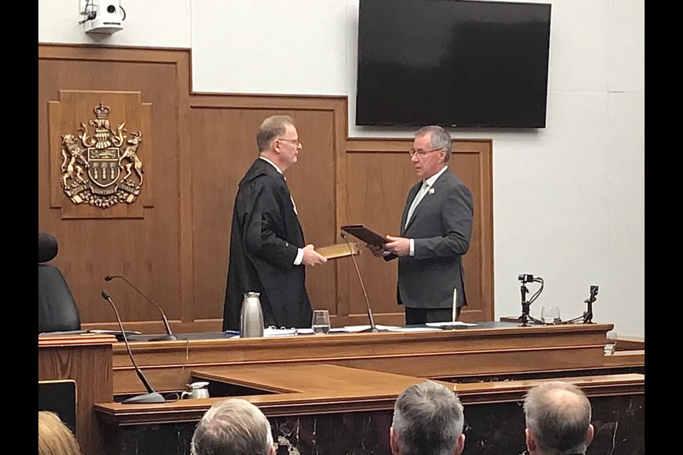 Chief Justice of Saskatchewan Robert Leurer is administered the oath of office by Lieutenant Governor Russ Mirasty.