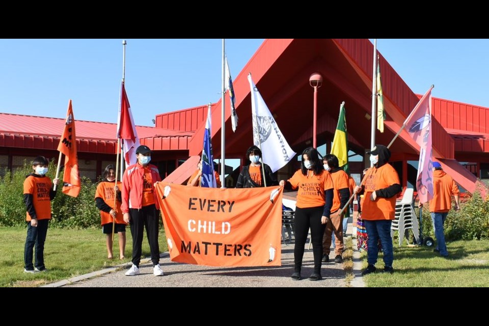 Cote Nation youth, described as leaders of tomorrow, carried the flags and led the way for all participating in the walk on the Cote First Nation on September 30.