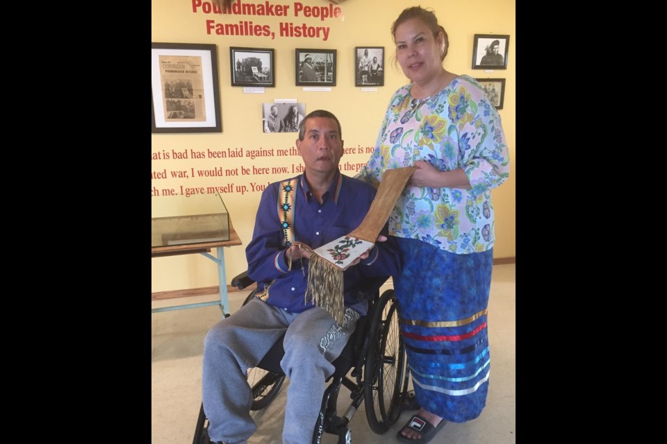 Chief Poundmaker descendant Rico Mirasty and wife Marcia Mirasty of Flying Dust First Nation accept the return of Poundmaker’s pipe bag. 