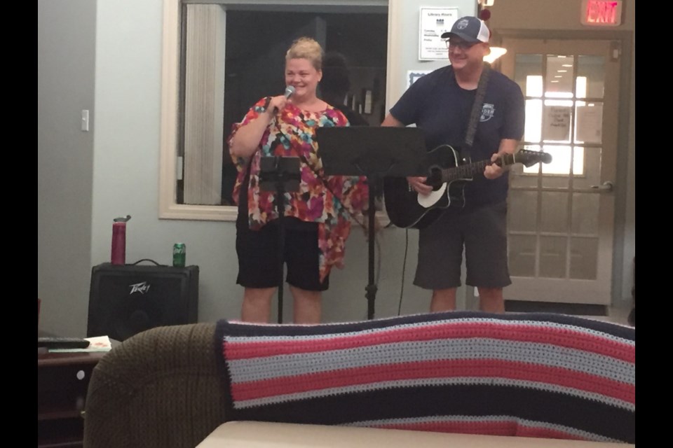 Kendall Redhead and Jamie Brandrick performing at the care home barbecue.