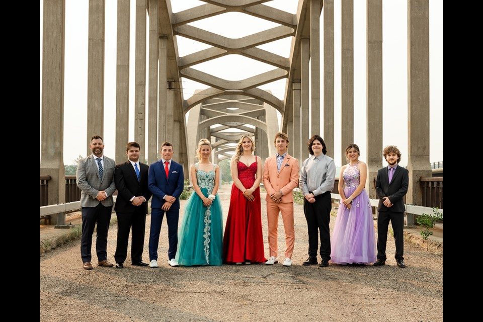 2023’s grad photo taken on the Historic Borden Bridge: Principal Trevor Gerwing, Noah Braun, Bill Hosegood, Sydney Schmidt, Raylene Rothenburger, Owen Dyck, Jack Donegan, Katelyn Worona, Jordan Finch. 