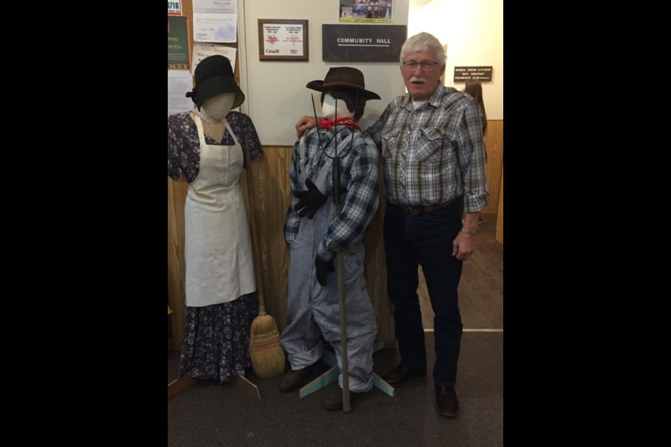 Ruben Rempel with mannequins at Borden Museum supper. 