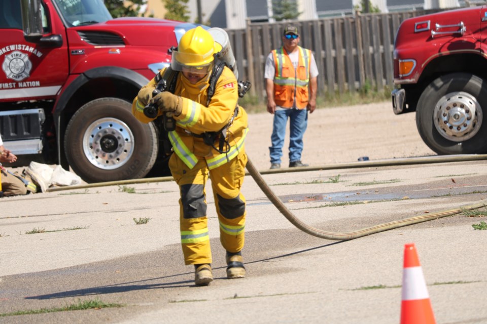 Dragging a fire hose.