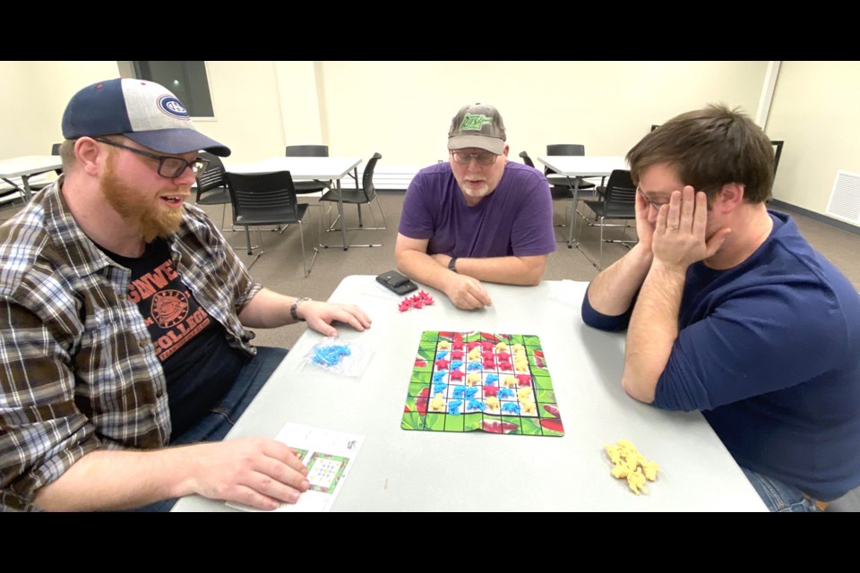 Adam Daniels, Trevor Lyons and Steven Schmidt in a game of fogs.