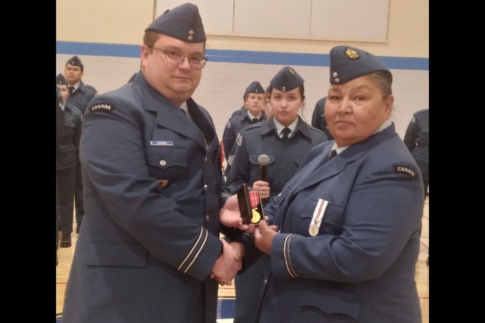 During a parade of the Kamsack air cadets on Feb. 26, Lt. Karen Tourangeau of Kamsack was presented with the Canadian Forces Decoration by Capt. Troy Rogowski of Preeceville.