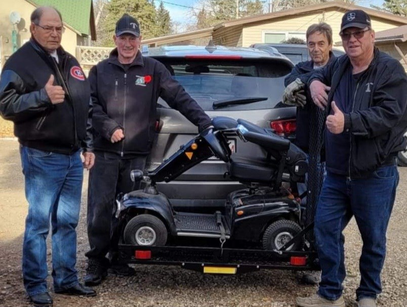 Maidstone Legion No. 142 members installed a scooter carrier on veteran Byron Lott’s vehicle Nov. 11. In the photo are Sam Kennedy, Byron Lott, Adrian Hume and Doug Wichman. 