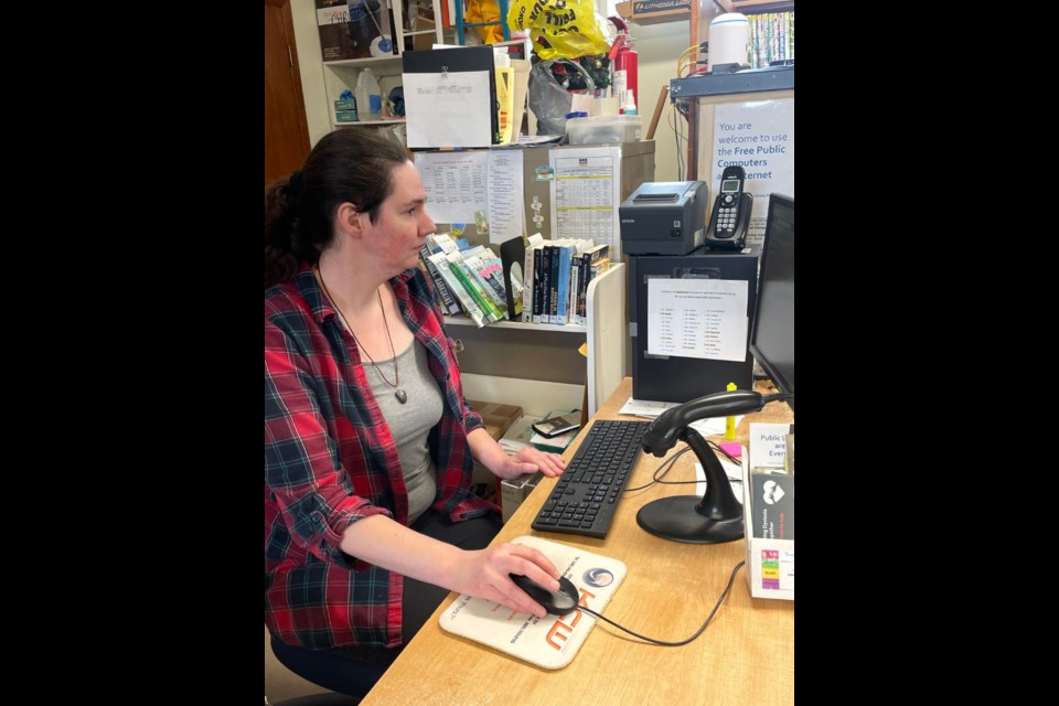 Librarian Sheri Babineau in Maymont hard at work.

