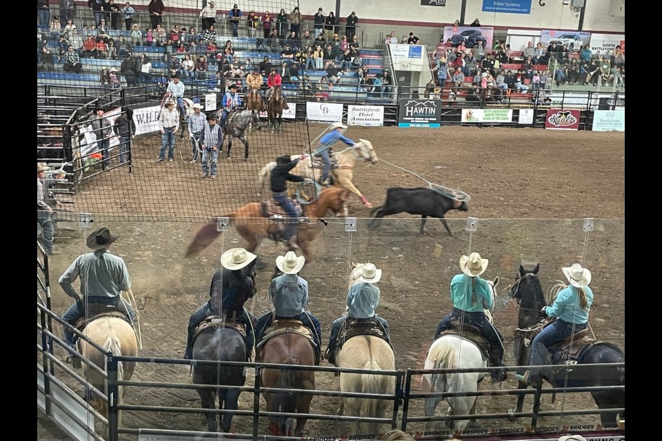 Excitement at the recent rodeo as the cowgirls wait on their well-groomed horses to assist when required. 