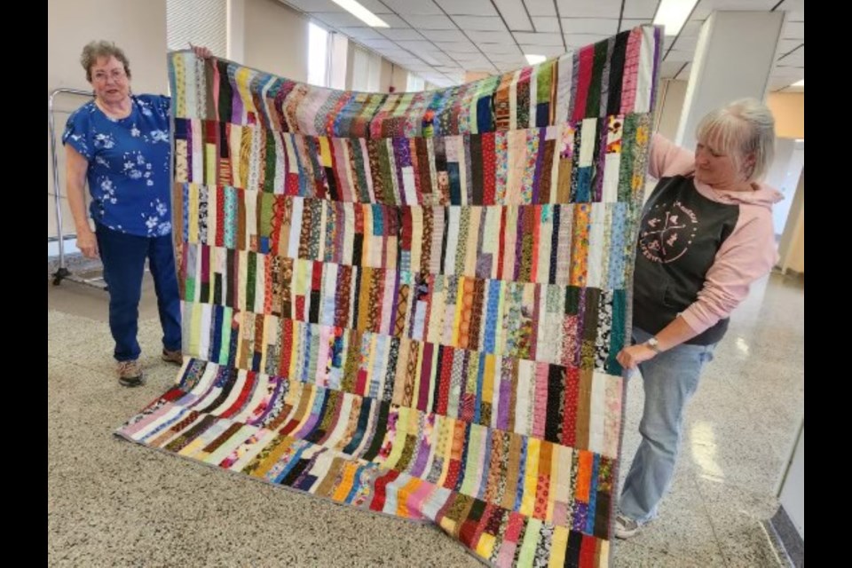 Members of the Rivers’ Edge Quilt Guild shared projects, including donated squares for a comfort quilt. 