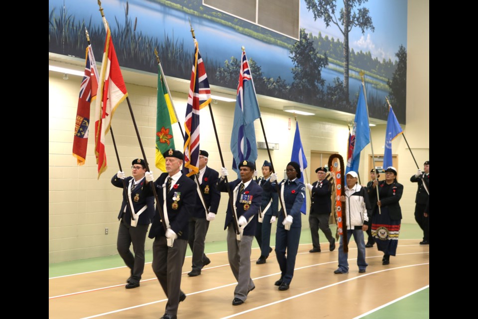 The colour party leads the parade.