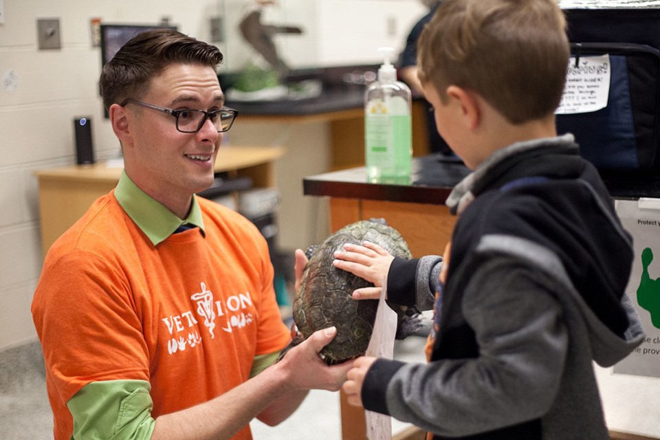 A student volunteer shows off a turtle during the 2019 Vetavision event at USask’s Western College of Veterinary Medicine. 