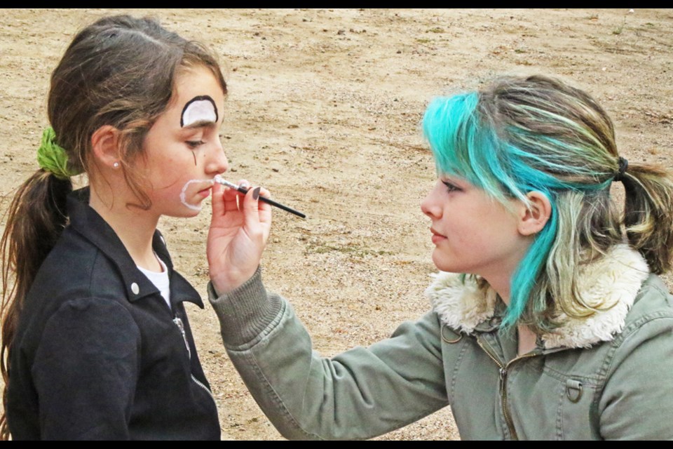 Nola Somerville sat patiently as Aubrey Lincoln painted a clown face at the face-painting booth, as part of the “Pumpkin Patch” fundraiser held in 2022 for the Weyburn Co-operative Playschool.