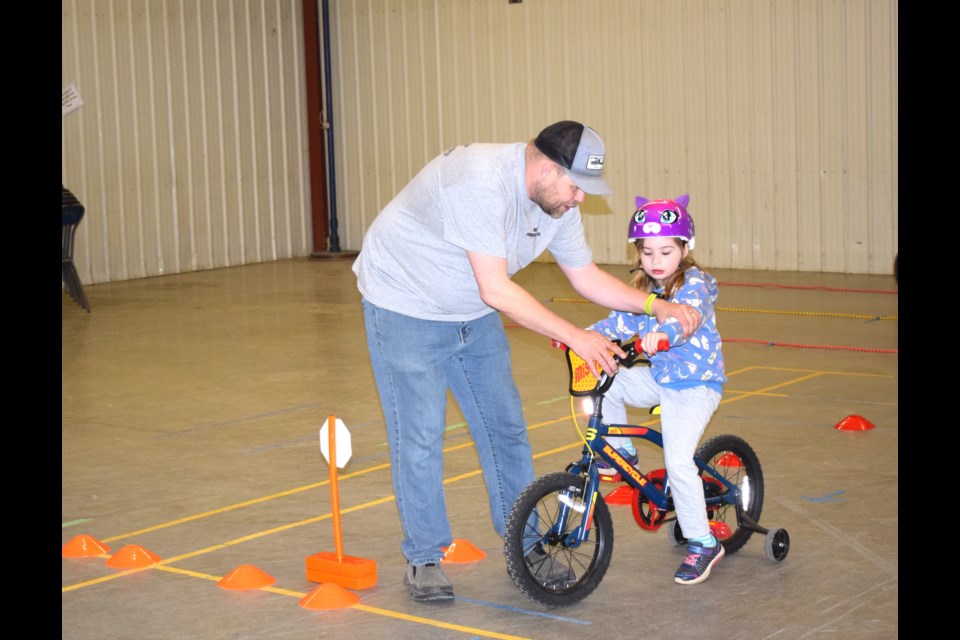 Desmond Bilsky with Hutt's Safety offered tips to Raven Severson.