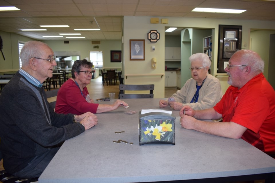 Earl Craig, Louise Fleck, Irene Craig and Dave Elliott had fun playing cards. 